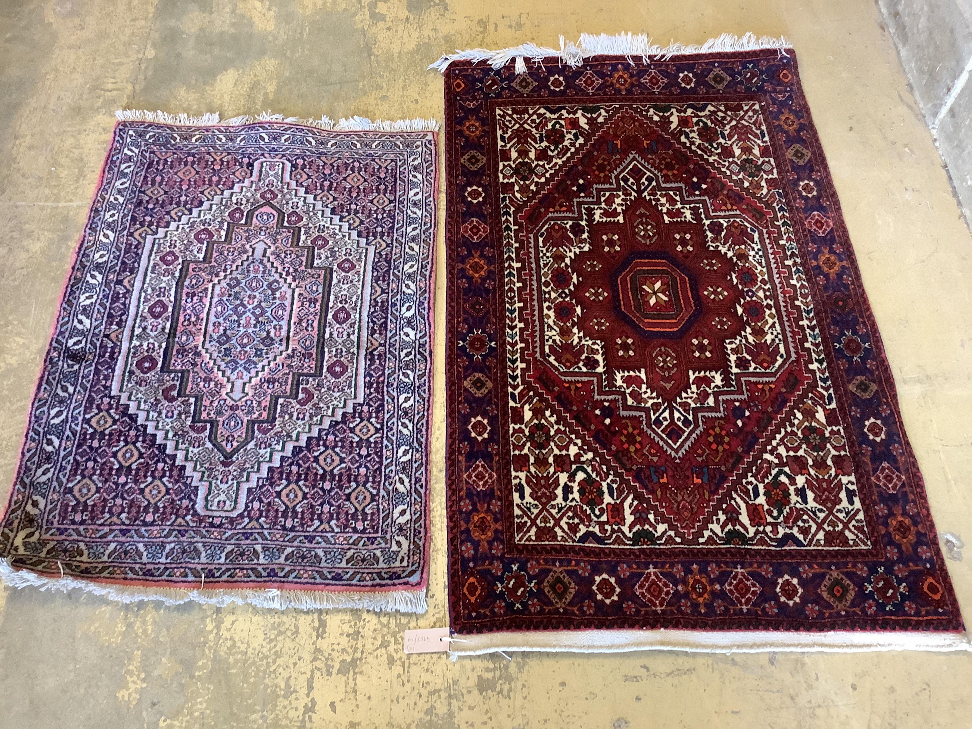 Two Senneh red ground mats, larger 130 x 80cm